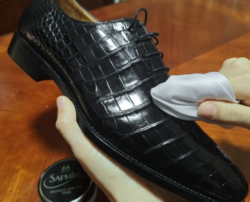 Shiny crocodile leather shoes after cleaning