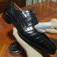 Shiny crocodile leather shoes after cleaning